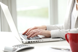 Woman typing on computer